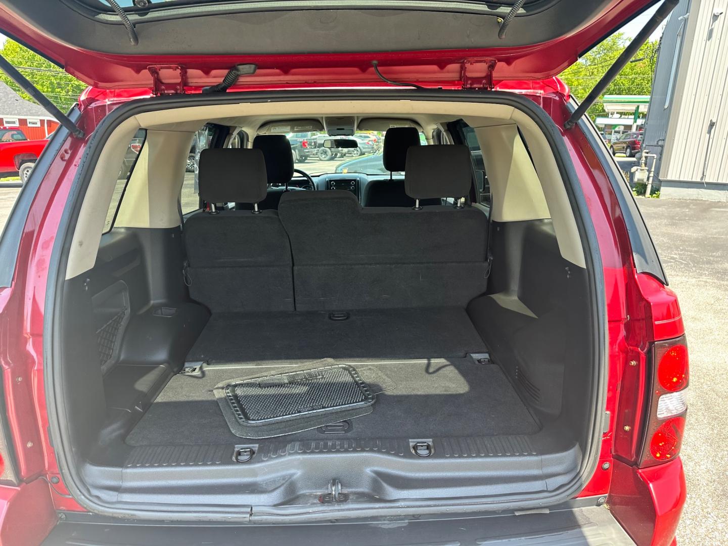 2009 Red /black Ford Explorer XLT (1FMEU73E89U) with an 4.0L V6 engine, 5-Speed Automatic transmission, located at 11115 Chardon Rd. , Chardon, OH, 44024, (440) 214-9705, 41.580246, -81.241943 - This 2009 Ford Explorer is a reliable and capable SUV, offering a 4.0L V6 engine paired with a 5-speed automatic transmission and full-time 4WD system. With a 3,500-pound towing capacity, it's suitable for moderate hauling needs. Additionally, the power driver's seat provides comfort and convenience - Photo#33